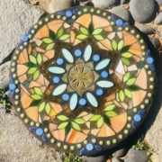 A colorful stone with a pattern of flowers.