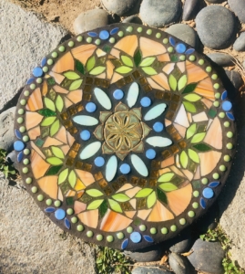 A colorful stone with a pattern of flowers.