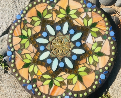 A colorful stone with a pattern of flowers.