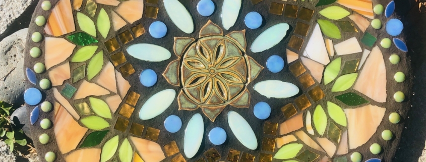 A colorful stone with a pattern of flowers.