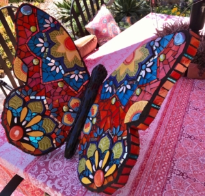 A colorful butterfly sitting on top of a table.