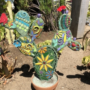 A cactus with many different designs on it.