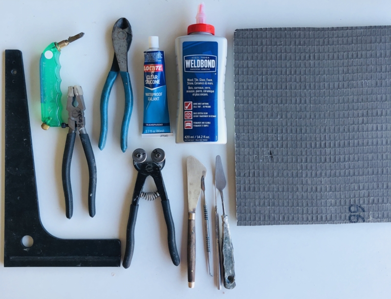 A table with some tools and a piece of cloth