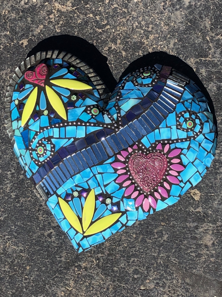 A blue heart with many different designs on it.